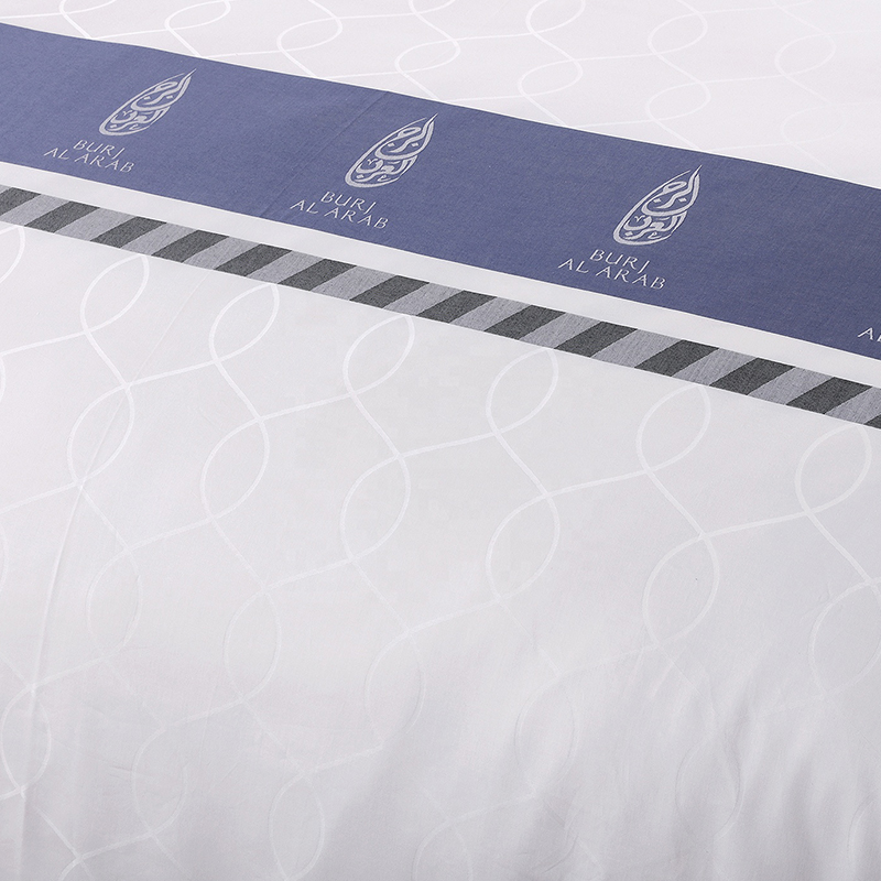 Set biancheria da letto in cotone 100% con logo personalizzato tinto in filo Set biancheria da letto in cotone 100% con logo personalizzato tinto in filo